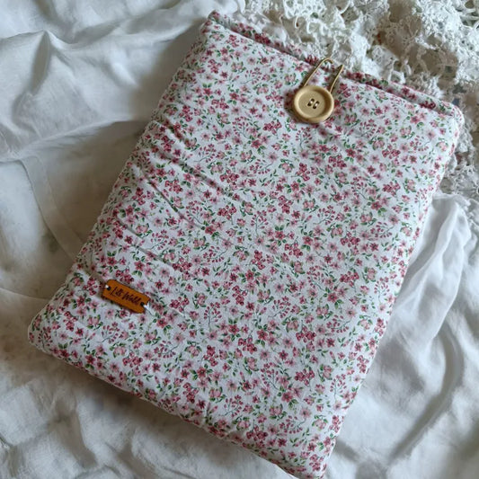 Funda para libro con diseño de plantas rojas fucsias, vista frontal