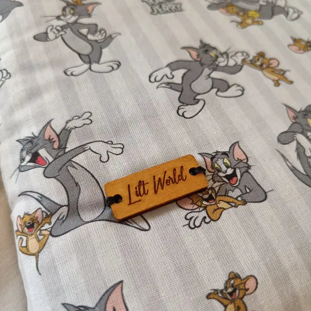 funda de tela acolchada para libro y libro electronico de tom y jerry